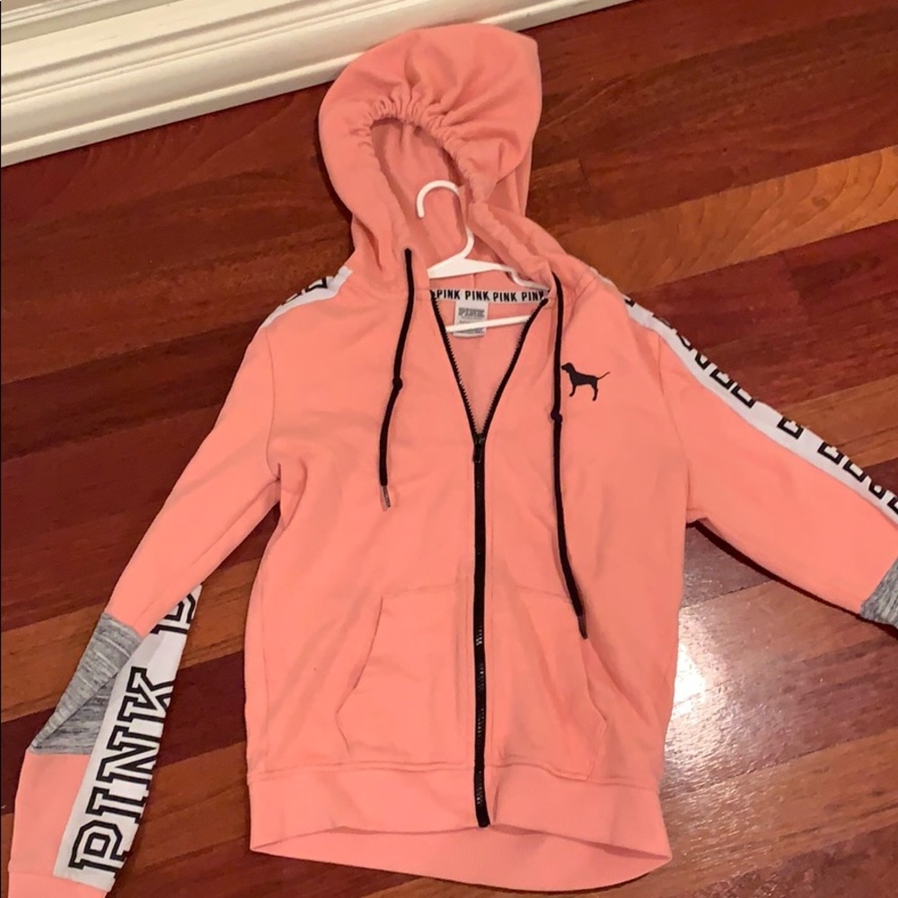 A pink sweatshirt from Victoria secret pink.